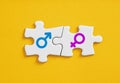 Male and female gender symbols on  puzzle pieces. Man and woman relationship, marriage and togetherness. Gender connection, Royalty Free Stock Photo