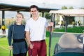 Male and female golfers ready for team play at golf course Royalty Free Stock Photo