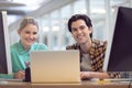 Male and female graphic designer discussing over computer Royalty Free Stock Photo