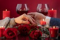 Male and female hand among melting candles Royalty Free Stock Photo