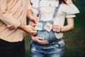 Hands with BOY and GIRL cards pregnant woman belly