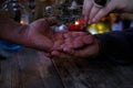 male, female hands close-up, session of magic in dark room of fortuneteller, magic items on table, Chiromancy Fortune Telling, Royalty Free Stock Photo