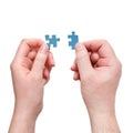 Male and female hands with little puzzle pieces Royalty Free Stock Photo