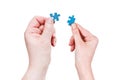 Male and female hands with little puzzle pieces Royalty Free Stock Photo