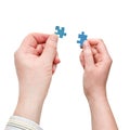 Male and female hands with little puzzle pieces Royalty Free Stock Photo