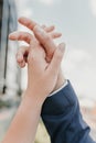 Male and female hands reach out to each other and touch the sky with their fingers Royalty Free Stock Photo