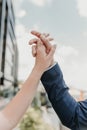 Male and female hands reach out to each other and touch the sky with their fingers Royalty Free Stock Photo