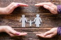 Male and female hands, silhouettes of a paper family concept caring Royalty Free Stock Photo