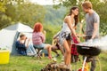 Male and female lovingly look each other while baked barbecue Royalty Free Stock Photo