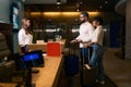 Male and female with luggage checking into hotel Royalty Free Stock Photo