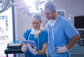 Male and female nurse using digital tablet in operation theater Royalty Free Stock Photo
