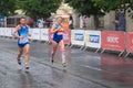 Male and female participants running on the central street of Dnipro city during of the `Interipe Dnipro Half Marathon` race