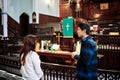 A male and female person having a religious conversation in front of the altar of the St. James United Church in Montreal, Quebec