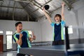 male and female ping pong doubles players excited during match Royalty Free Stock Photo
