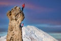 Male and female rock climbers with the lead that secures the partner Royalty Free Stock Photo