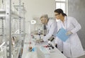 Male and female scientist analyzing results on computer screen at laboratory Royalty Free Stock Photo