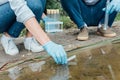 male and female scientists taking sample of water in test flask Royalty Free Stock Photo