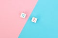 Male and female sex icons on cubes on pink and blue background. Sex change, gender reassignment, transgender and sexual identity