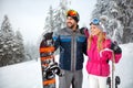 Male and female on skiing for winter holiday