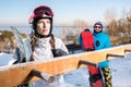 Male and female snowboarders