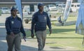 A Male and female South African traffic police officers waering protective vests