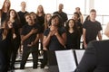 Male And Female Students Singing In Choir With Teacher At Performing Arts School Royalty Free Stock Photo