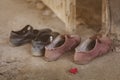 Male and female students take off their shoes at the front entrance of an abandoned cottage. Premarital Sex concept.