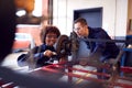 Male And Female Students Working On Car Brakes On Auto Mechanic Apprenticeship Course At College Royalty Free Stock Photo