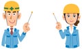 A male and female upper body wearing a helmet wearing blue work clothes explained by a pointer