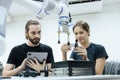 Male and female using tablet staff engineer with robot for education at class room. Education for future robotics learning Royalty Free Stock Photo