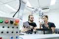 Male and female using tablet staff engineer with robot for education at class room. Education for future robotics learning Royalty Free Stock Photo