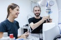 Male and female using tablet staff engineer with robot for education at class room. Education for future robotics learning Royalty Free Stock Photo