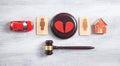 Male and female wooden symbols, gavel, house, car, broken heart and judge gavel