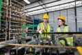 Male and Female worker inspect goods auto parts on shelves in warehouse. logistic import export auto parts. Checklist stock