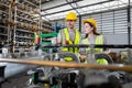 Male and Female worker inspect goods auto parts on shelves in warehouse. logistic import export auto parts. Checklist stock