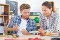 male and female workers in discussion in workshop Royalty Free Stock Photo