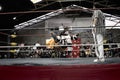 Male and female wrestlers in combat at the Cholitas Wrestling