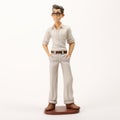 Cartoon Realism: Hyper-realistic Figurine Of Man In White Shirt And Pants