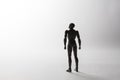 Male figurine silhouette standing in powerful pose looking up on