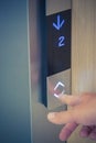 Male finger pushing elevator down button Royalty Free Stock Photo