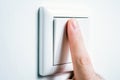 Male Finger Touching A Light Switch To Turn The Light On Or Off Royalty Free Stock Photo