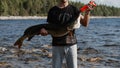 male fisherman holds a large fish pike caught in his hands Royalty Free Stock Photo