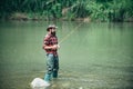 Male fishing on the lake. Relax in natural environment. Good profit. Carry on fishing. Man relaxing and fishing by Royalty Free Stock Photo