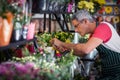 Male florist checking a flowers