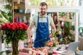 Male florist in flower shop Royalty Free Stock Photo