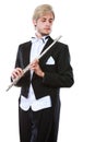 Male flutist wearing tailcoat holds flute