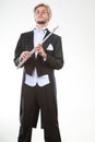 Male flutist wearing tailcoat holds flute