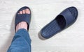 Male Foot Wearing a Slipper Royalty Free Stock Photo