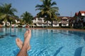 Male foots and swimming pool Royalty Free Stock Photo