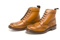 Male Footwear Ideas. Pair of Premium Tanned Brogue Derby Boots Royalty Free Stock Photo